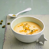 Yellow peach mousse with pistachios