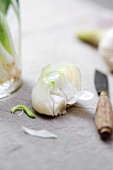 Peeling a fresh garlic clove