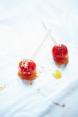 Cherry tomatoes with citronelle caramel, sesame seeds and poppy seeds