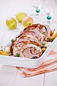 Thick round pork fillet stuffed with apples and pistachios