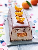 Chestnut and date ice cream log cake with confit clementine