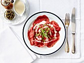 Beef carpaccio with capers and parmesan sauce