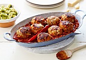 Chicken meatballs with stewed red hot pepper tomatoes
