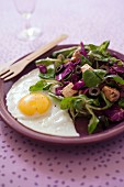 Fried egg with corn lettuce,red cabbage,feta and olive salad
