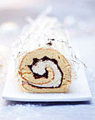 Yule log with vanilla cream and chocolate (Christmas)