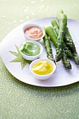 Green asparagus with three dip sauces