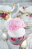 Cupcake decorated with a sugar flower