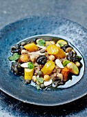 Spelt couscous with snails, yellow zucchinis and two types of carrots