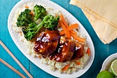 Chicken in barbecue sauce with rice and peas