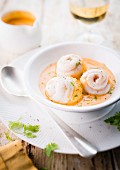 Cream of pumpkin soup with rolled sole fillets