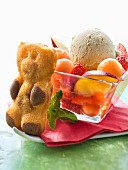 Summer fruit salad,bear cookie and a scoop of vanilla ice cream