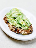 Avocado on sliced bread with curry oil