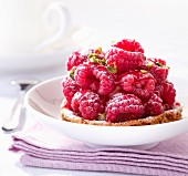 Raspberry and crushed pistachio tartlet