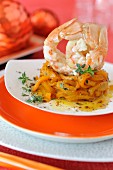 Roasted langoustine tails with yellow peppers and orange