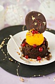 Thick piece of chocolate truffle,mango ice cream,redcurrants and a chocolate-pink peppercorn Palet