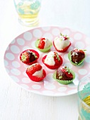 Strawberry delicacies dipped in white and dark chocolate