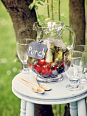Jug of mixed fruit punch outdoors