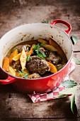 Pork's cheeks and carrot stew with bay leaves