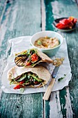 Pita bread with eggplant, red bell peppers and hummus