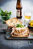 Pork Burger with apples and pickles in beer