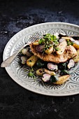 Fried turkey escalope with sautéed potatoes and Brussels sprouts