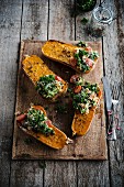 Baked Butternut Squash filled with kale, semolina and raisins
