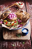 Falafel and raw vegetable burger with beetroot salad