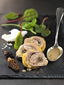 Guinea-fowl rolled fillets garnished with morels in salt crust,yellow wine gravy