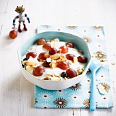 Yoghurt fresh and dried grapes and thinly sliced almonds