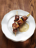 Lamb skewer with chorizo and pepper sauce