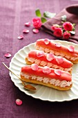 Eclairs decorated with rose petals