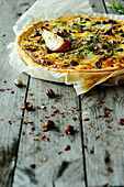 Autumn tart with chicory, pears, goat cheese and hazelnuts (vegetarian)