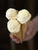 White chocolate and strawberry coulis ice cream cones