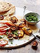 Grilled tandoori fish skewers with limes