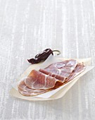 Slices of Bayonne ham on wax paper
