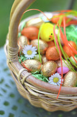 Small basket of Easter eggs outdoors