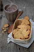 Gingermen biscuits and a cup of chocolate