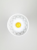 Raw egg yolk in egg white emulsion in a bowl