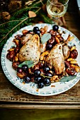 Quail roasted with black grapes, almonds, chestnuts and sage
