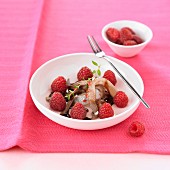 Raw herrings with raspberries and balsamic cream