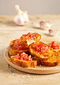 Toasted bread rubbed with garlic and topped with crushed tomatoes
