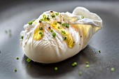 Poached egg with olive oil and chives