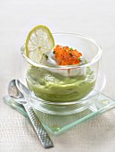 Pureed avocado with salty whipped cream and salmon eggs