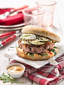 Grilled courgette and confit tomato hamburger