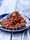 Warm lentil salad with stewed red peppers and aubergines