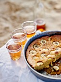 Banana cake and glasses of fizzy apple juice
