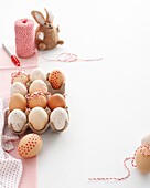 Cardboard box with decorated eggs for Easter