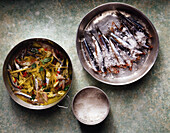 Sardines marinated in oil and lemongrass and sardines in coarse salt
