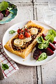 Onion, goat's cheese and roasted tomato tartlet, beetroot-spinach salad