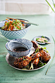 Chicken drumsticks with rice noodles and vegetables (Asia)